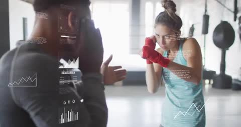 Boxing coach guiding athlete through jab drill while HUD analytics tracking performance
