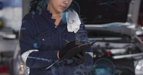 Female auto technician inspecting car engine with clipboard and digital hud overlay