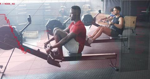 Athlete powering rowing ergometer with live performance analytics overlay in modern gym studio