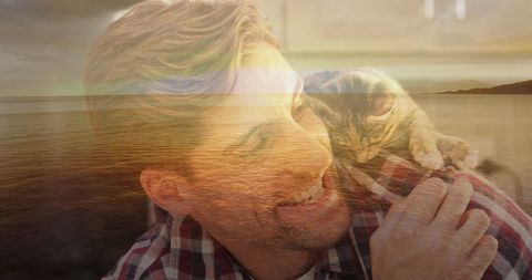 Man and Cat Enjoying Scenic Beach Sunset