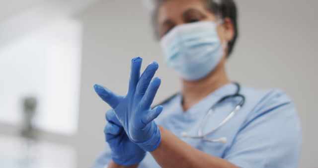 Doctor Wearing Blue Surgical Glove with Stethoscope in Clinic - Download Free Stock Images Pikwizard.com