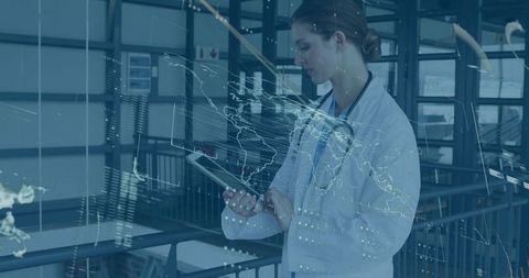 Female Doctor Analyzes Tablet with Healthcare Data Overlays