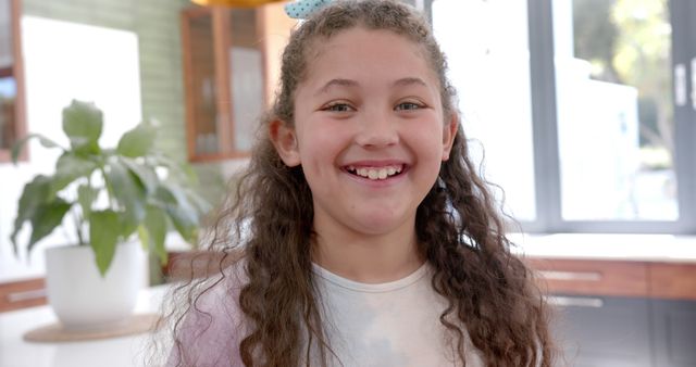 Joyful Young Girl Smiling in Bright Kitchen - Download Free Stock Images Pikwizard.com