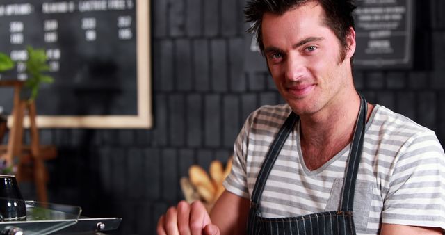 Smiling Male Barista Working in Cafeteria - Download Free Stock Images Pikwizard.com