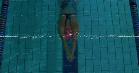 Underwater shot of female swimmer in professional training session