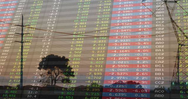 Superimposed stock market data over rural dusk scene