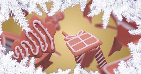 Gingerbread cookies with icing among snowy branches