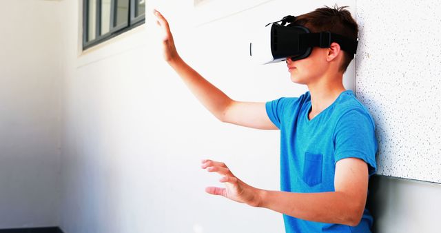 Teen Boy Using VR Headset in Modern Setting - Download Free Stock Images Pikwizard.com