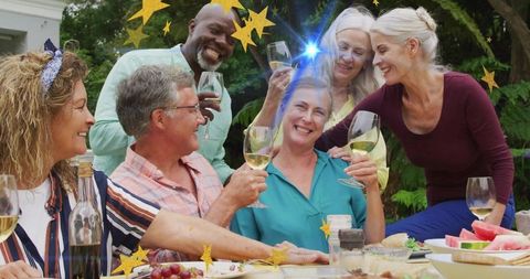Group of Friends Celebrating with Wine on Patio