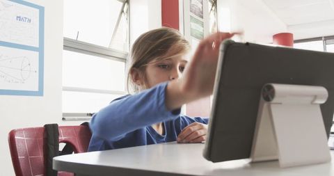 Boy Using Tablet in Classroom for Interactive Learning Activity - Download Free Stock Images Pikwizard.com