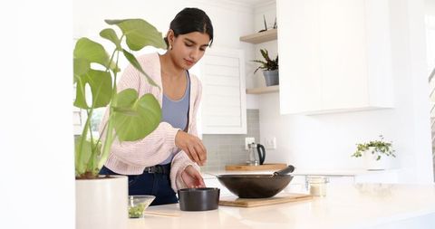Young Woman Cooking in Modern Kitchen Interior Lifestyle Encounter