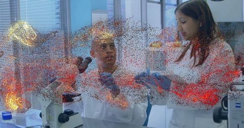 Scientists Conducting Cutting-Edge Research Using Microscope