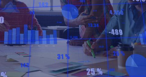 Diverse Team Collaborating Amidst Financial Data Projections