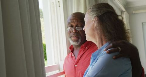 Happy Senior Couple Embracing in Living Room