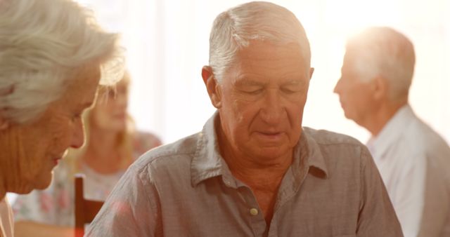 Senior Citizens Socializing in Bright Room - Download Free Stock Images Pikwizard.com