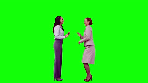 Successful Business Team Celebrating in Front of Green Screen