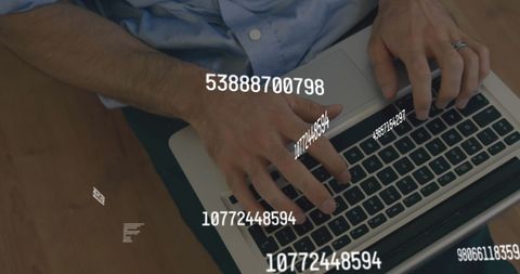 Man Typing on Laptop with Floating Numbers Overlay