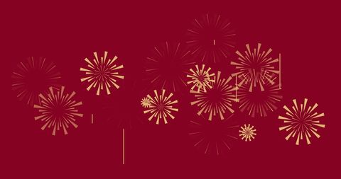 Golden Fireworks Sparkling on Vibrant Red Background