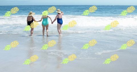 Senior Women Enjoying Beach With Fun Pineapple Overlay