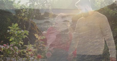 Couple Enjoying Stroll Through Rose Nursery Amid Lush Greenery