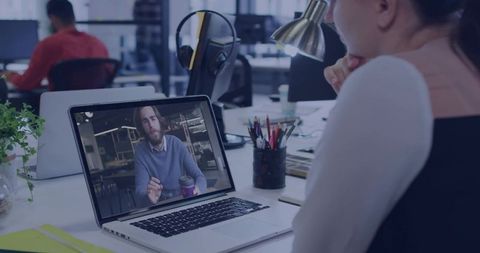Business Professionals Engaged in Video Call in Modern Office Setting