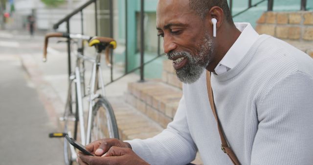 Senior African American Man Using Smartphone While Enjoying Outdoors - Download Free Stock Images Pikwizard.com