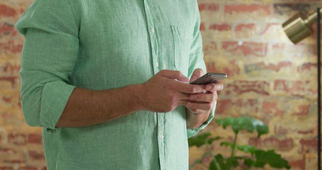 Man Texting on Smartphone in Relaxed Home Environment - Download Free Stock Images Pikwizard.com