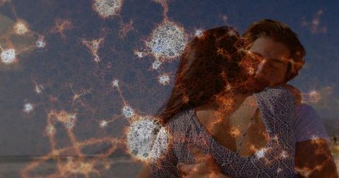 Embracing Couple on Twilight Beach with Starburst Double Exposure Effect