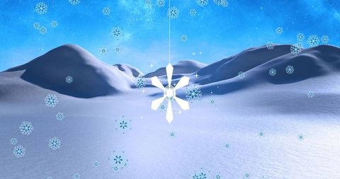 Hanging geometric snowflake ornament over smooth snowy dunes under vivid blue sky