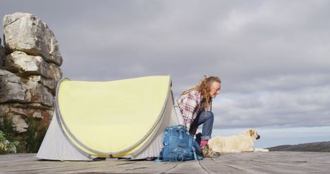 Woman Enjoying Mountain Adventure with Dog and Tent - Download Free Stock Images Pikwizard.com