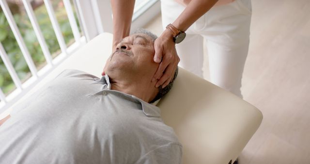 Depicting a chiropractor performing a neck adjustment on a senior patient. Ideal for use in articles about chiropractic care, senior healthcare, alternative therapies, neck pain relief, medical treatments, and wellness practices.