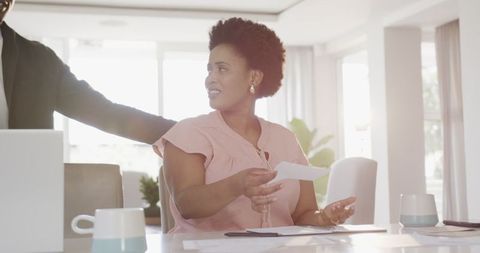Couple reviewing finances and planning budget together at home