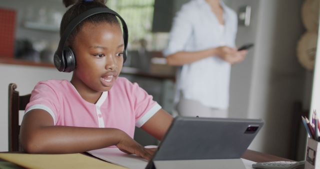 Focused African American Girl Studying Online with Tablet and Headphones - Download Free Stock Images Pikwizard.com