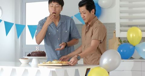Friends Enjoying Birthday Celebration with Cake and Snacks