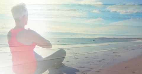 Serene Senior Woman Practicing Yoga on Sunny Beach - Download Free Stock Images Pikwizard.com
