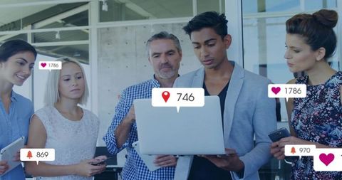 Collaborative Team Analyzing Social Media Engagement Stats