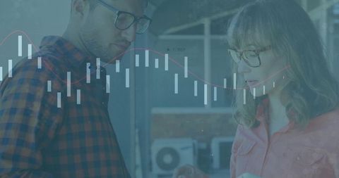 Finance Team Analyzing Candlestick Chart in Modern Office