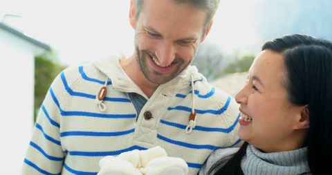 Interracial Couple Sharing Joyful Moment in Nature