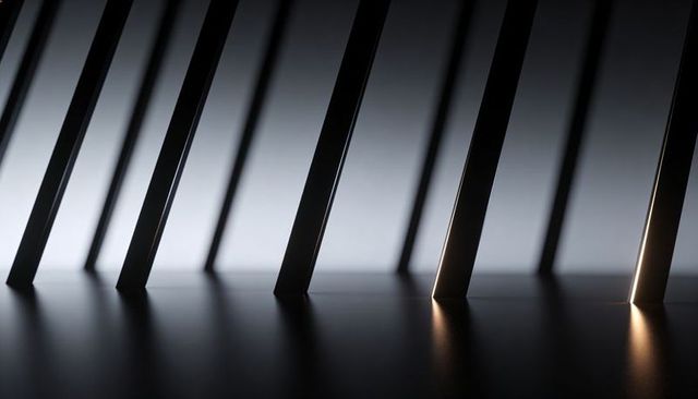 Leaning slanted metal bars casting long shadows and led highlights on smooth surface