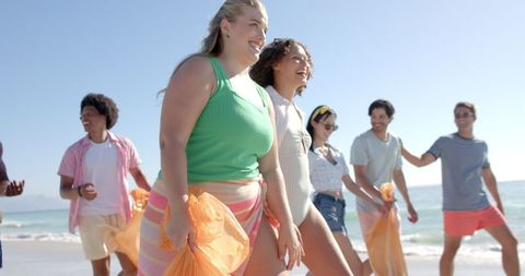 Diverse Friends Enjoying Sunny Day Beach Gathering