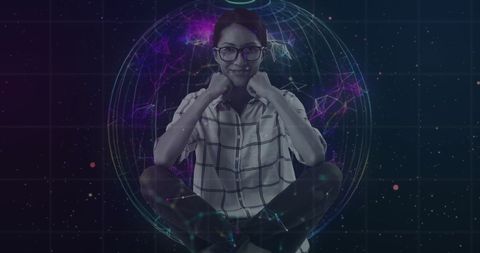 Woman with futuristic globe hologram analyzing graphs