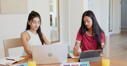 Diverse Young Women Collaborating on Creative Academic Project