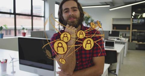 Bearded professional in office embracing modern technology