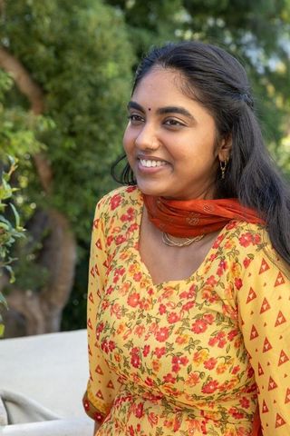 Young Woman in Traditional Indian Attire Relaxing Outdoors