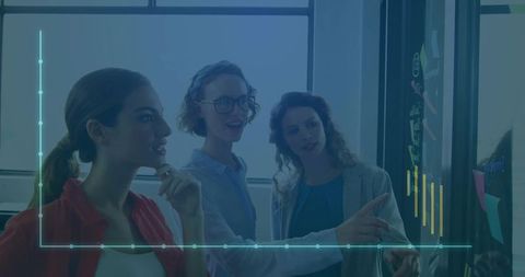 Creative Business Team Analyzing Data with Touchscreen