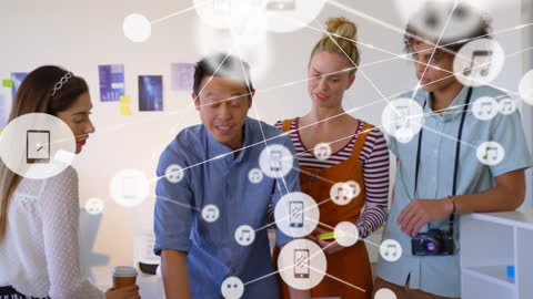 Young Diverse Professionals Collaborating on Laptop Technology