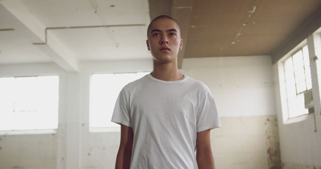 Confident Young Man in Minimalist Industrial Space - Download Free Stock Images Pikwizard.com