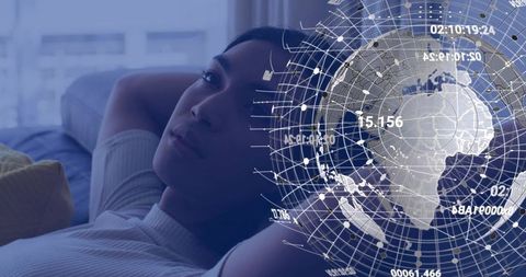 Contemplative Man Reclining on Sofa Gazing at Futuristic Holographic Data Globe Overlay