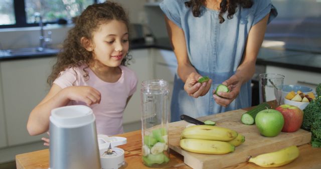 Mother and Daughter Making Healthy Smoothie in Kitchen - Download Free Stock Images Pikwizard.com