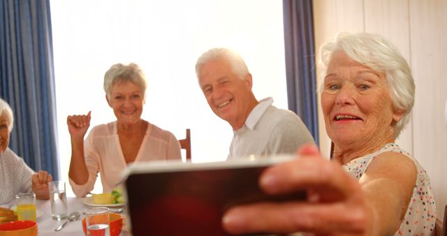 Happy Senior Friends Taking Selfie During Breakfast at Home - Download Free Stock Images Pikwizard.com